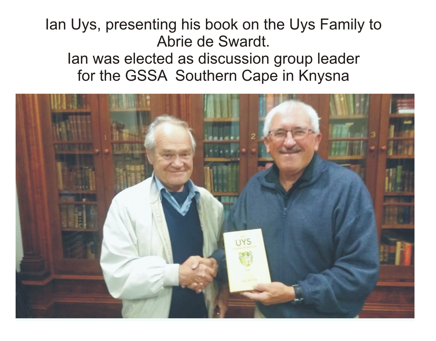 Ian Uyspresents his book on the Uys family to Abrie de Swardt.Ian was elected as discussion group leader of the GSSA Southern Cape in Knysna